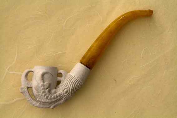 Clay pipe in eagle's claw shape